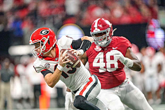 Georgia QB Stetson Bennett evades a defender in the CFP title game.